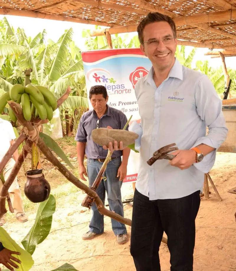 Patrick Struebi with a grower among banana plants.